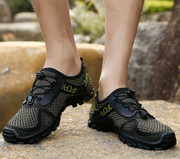 Men's breathable elastic camping shoes with mesh upper and rubber outsole, ideal for outdoor activities.